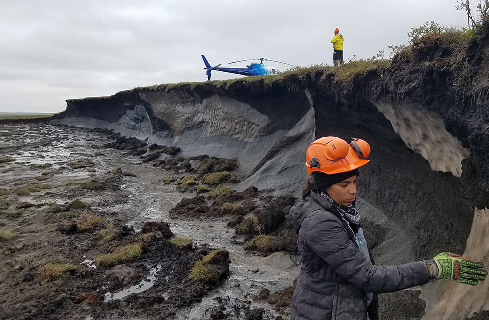Jacqueline Goordial taking methane measurements from the permafrost headwall at a thaw slump in the North West Territories