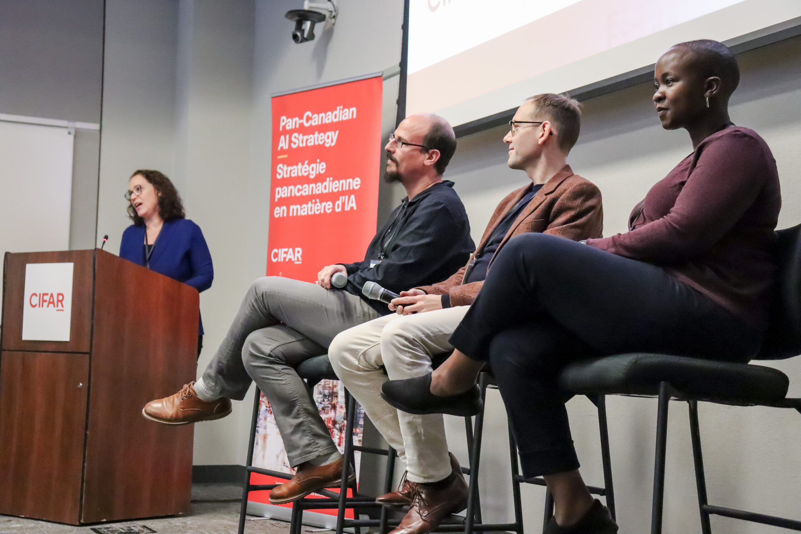 Elissa Strome, Executive Director of the Pan-Canadian AI Strategy at CIFAR moderates a panel discussion with industry leaders Guillaume Rabusseau, Marc Bellemare and Shingai Manjengwa.