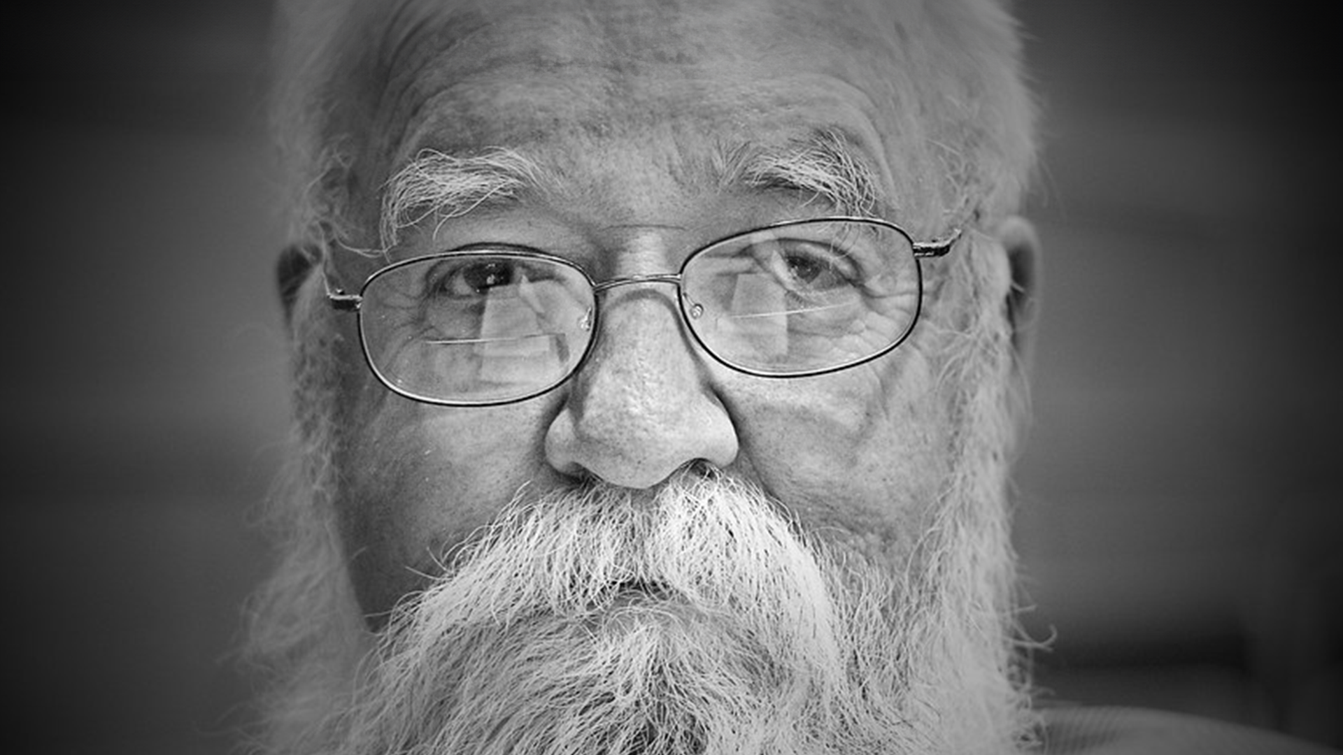 A black and white photo of Daniel Dennett