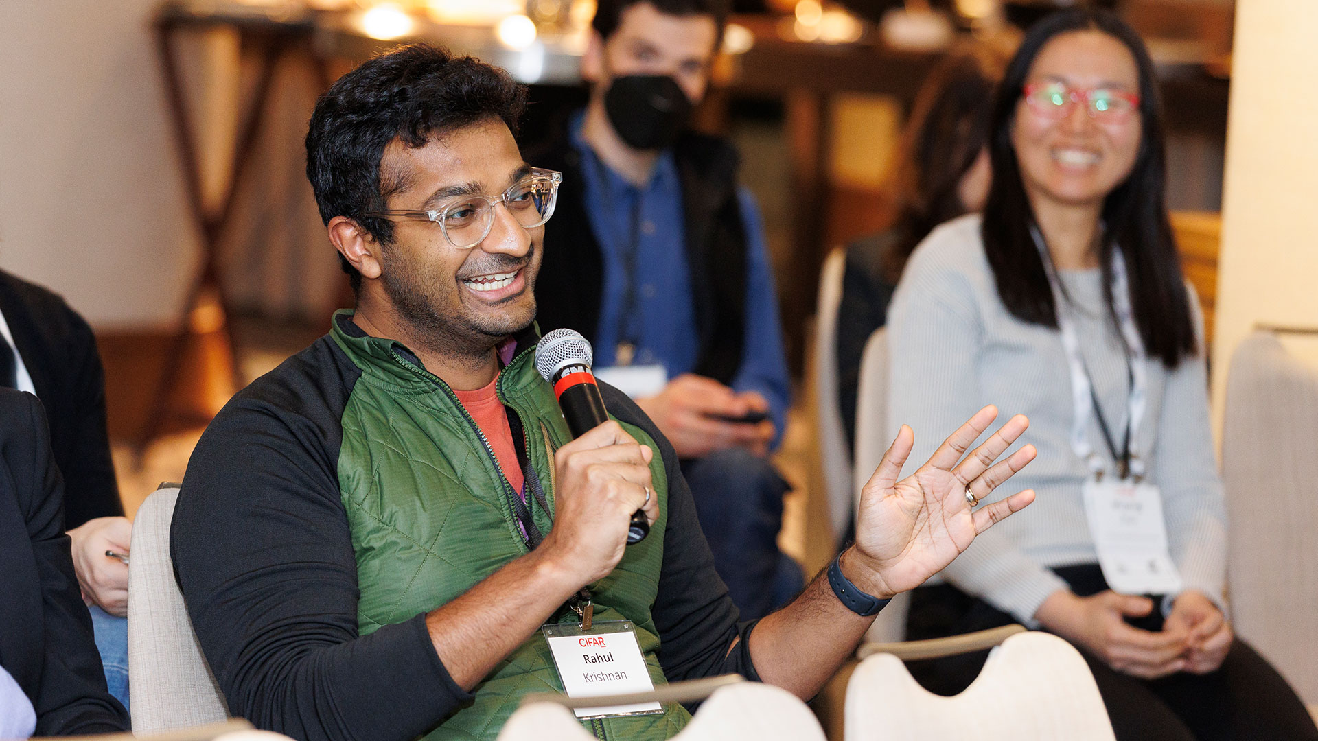 Rahul Krishnan speaking in to a microphone