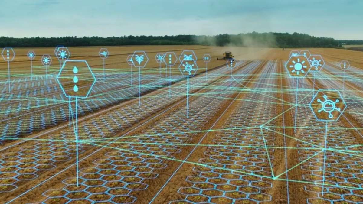 futuristic agriculture field with tractor and blueprint on top